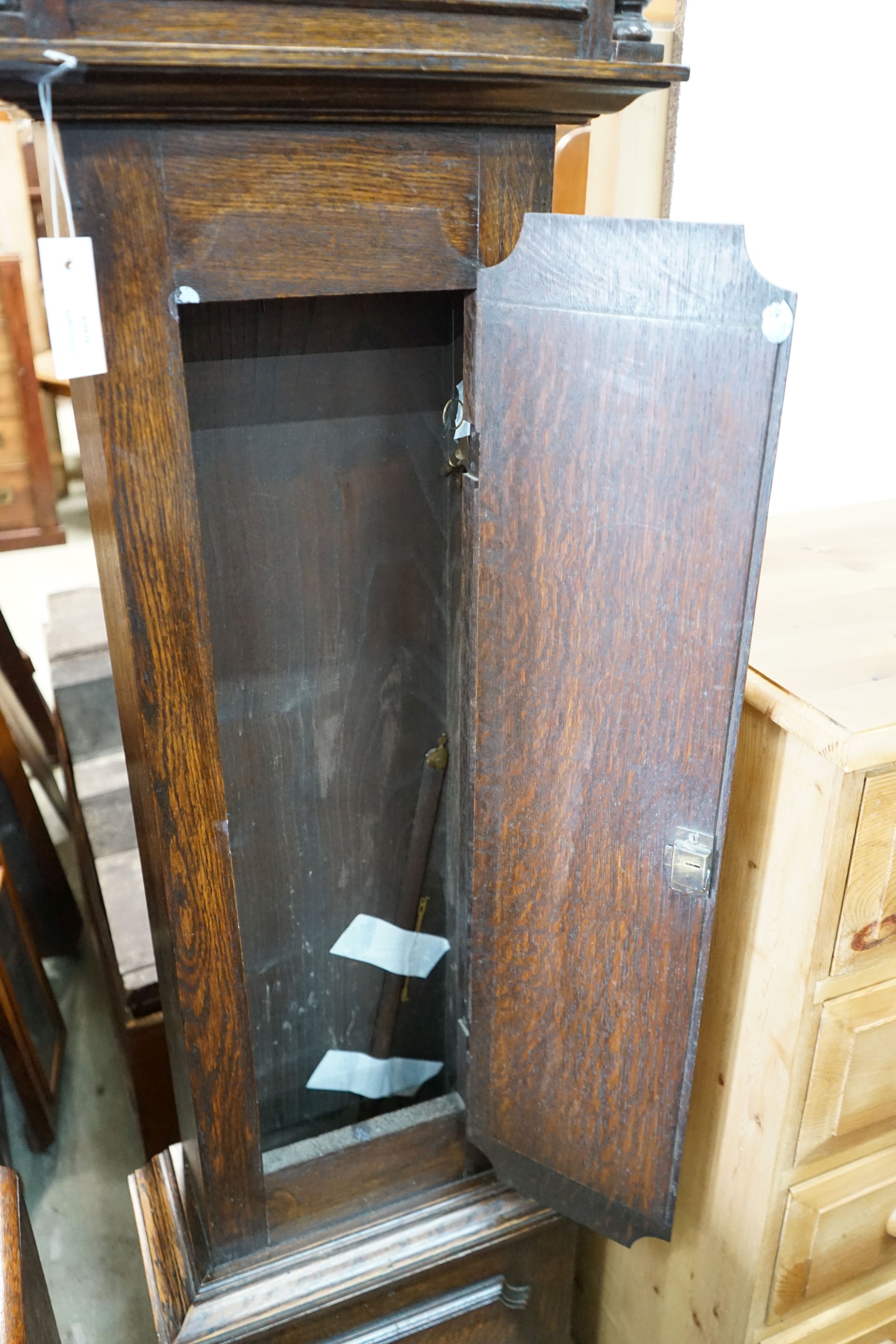 A 1920's oak 8 day longcase clock, height 187cm